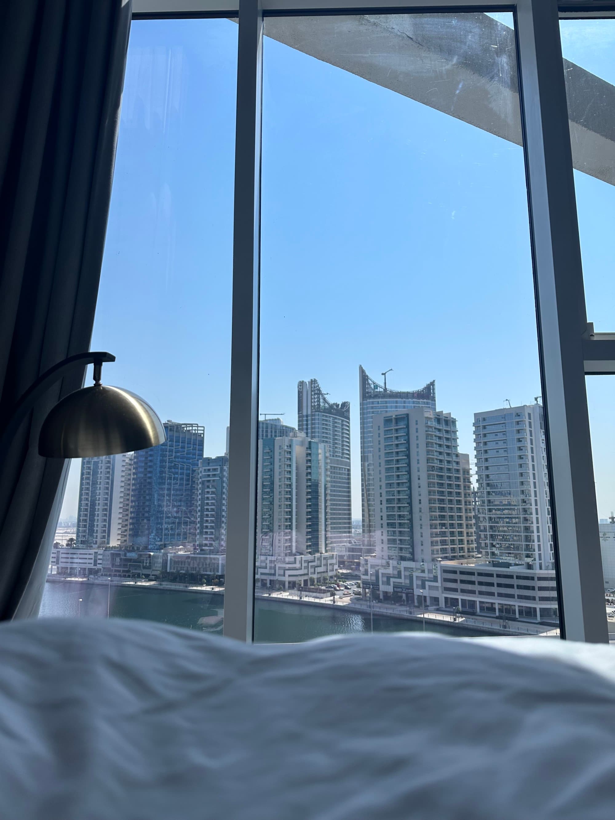 View of a city skyline from a hotel room window