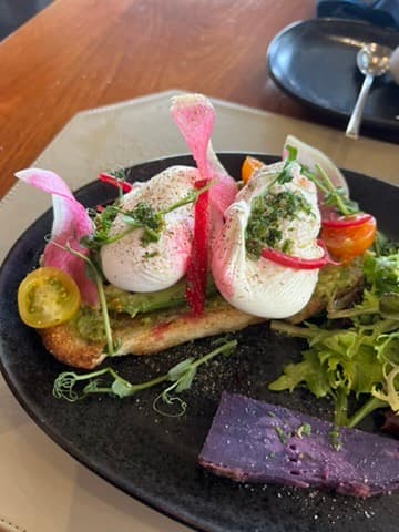 Food on a black plate on a table