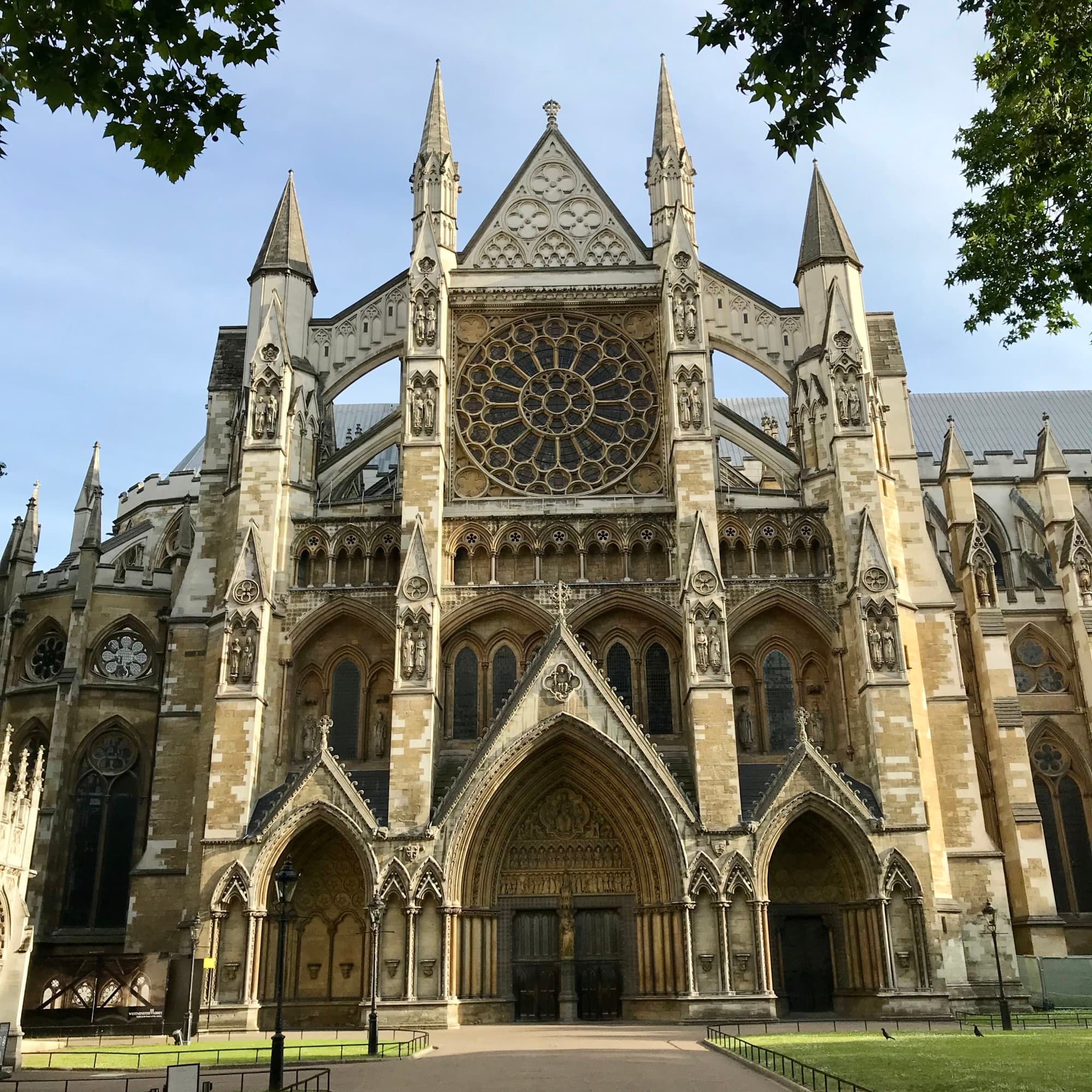 A view of Westminster Abbey with it's stone architecture and stained glass windows.