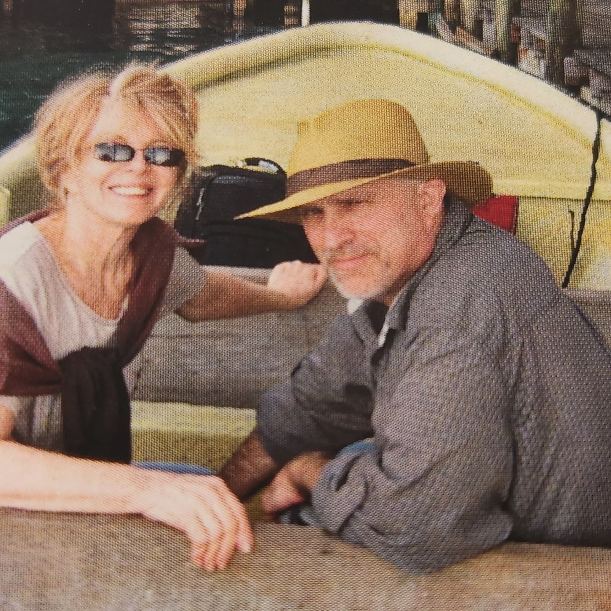 A couple posing for a photo in a boat