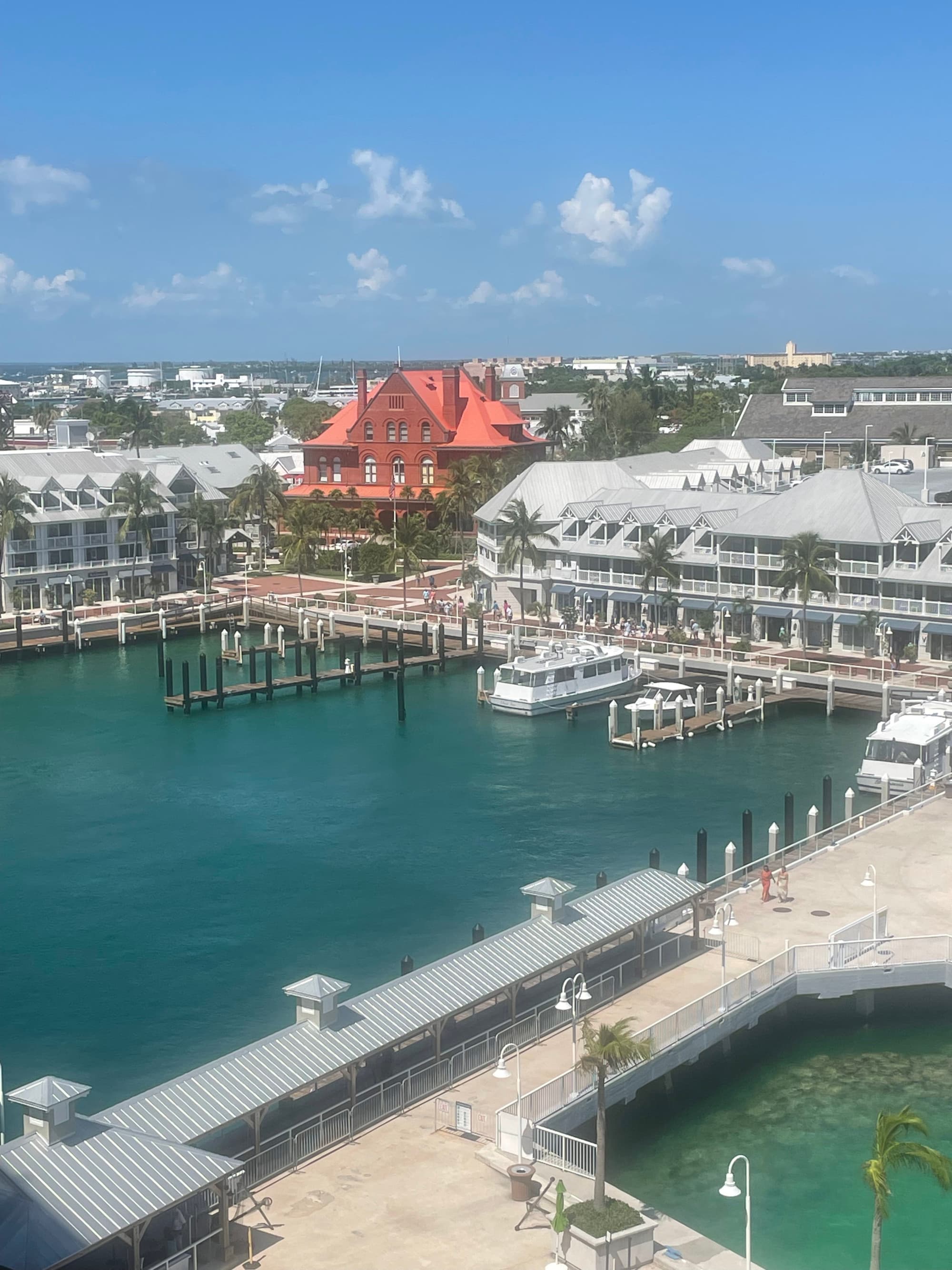 A view of a harbor and pier on a sunny day.