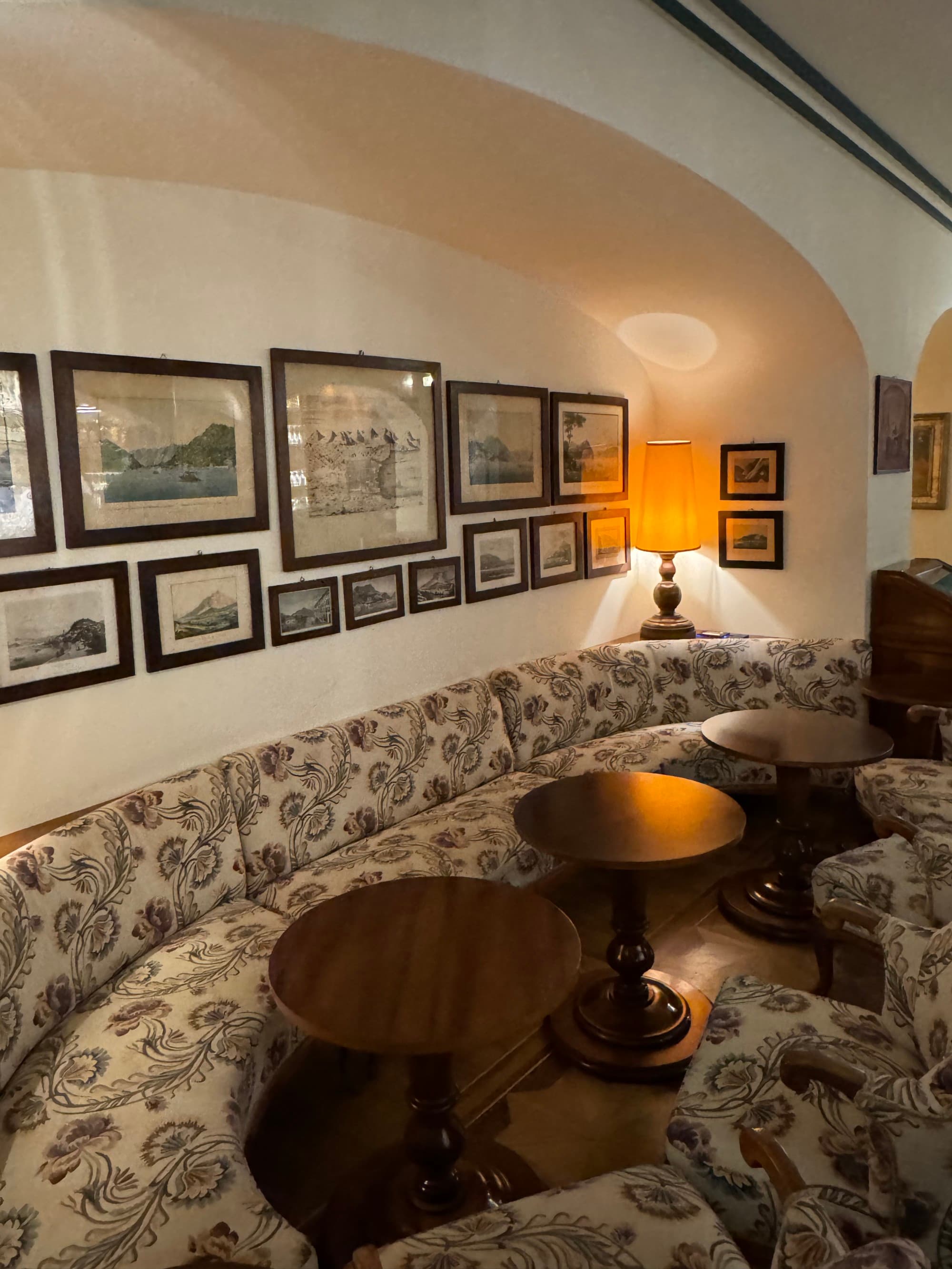 Sitting area richly furnished with wall hangings.