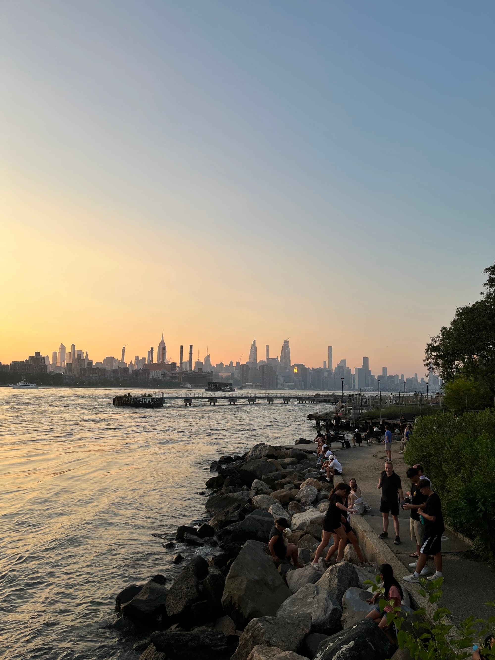 a city on a river at dusk