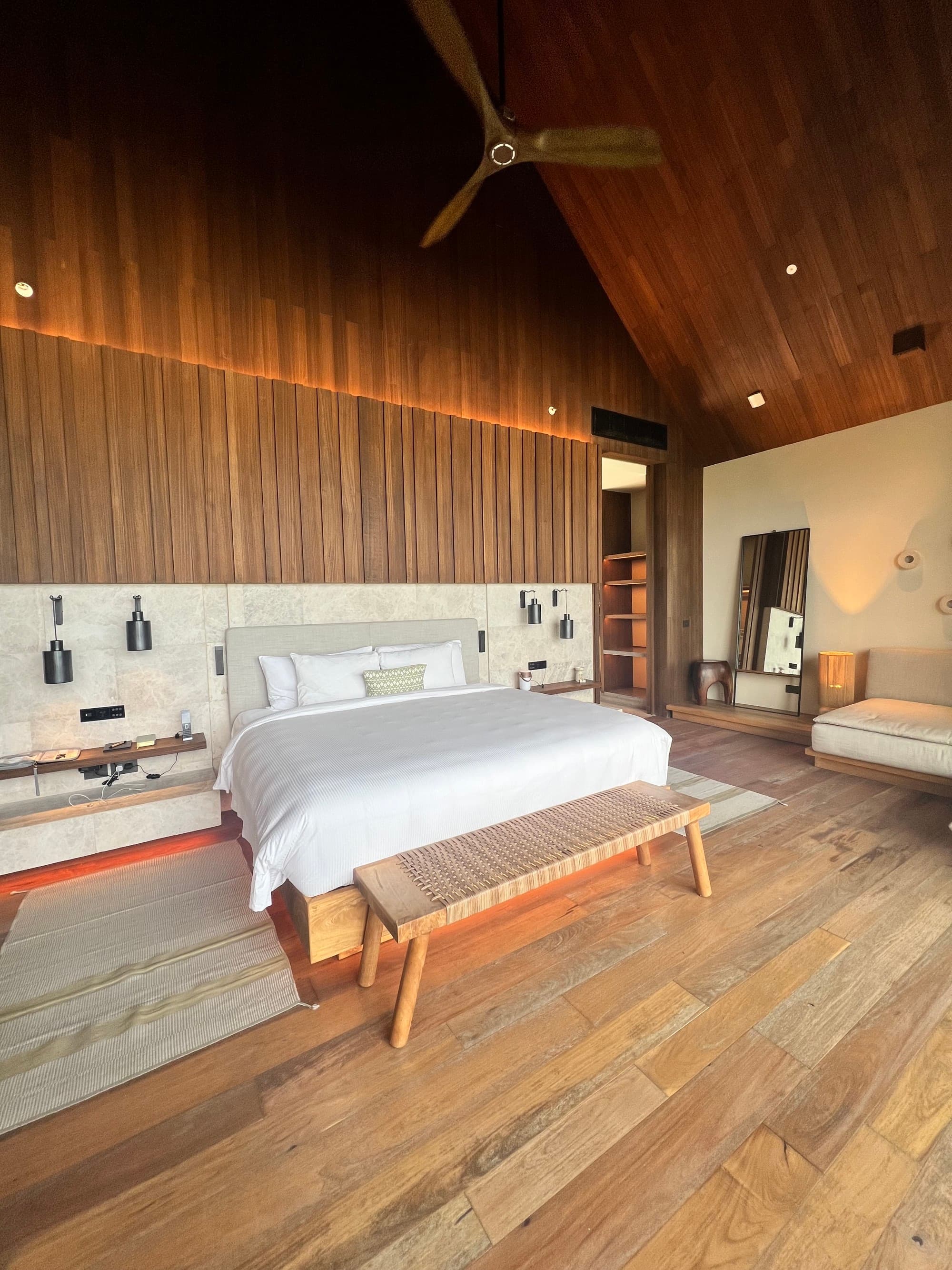 Banyan Tree hotel room with a very natural interior and high ceilings.