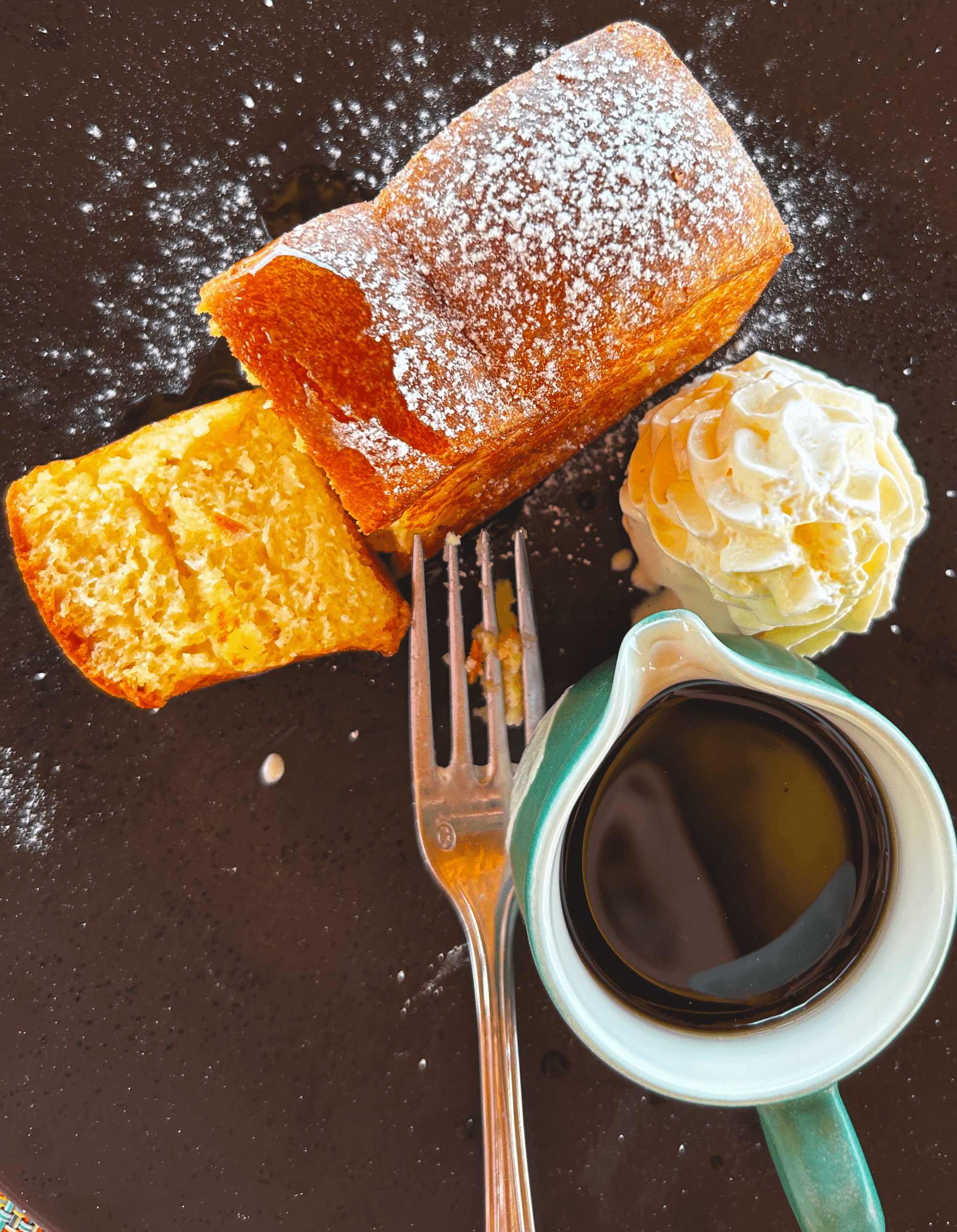 Breakfast sweets on a dark plate