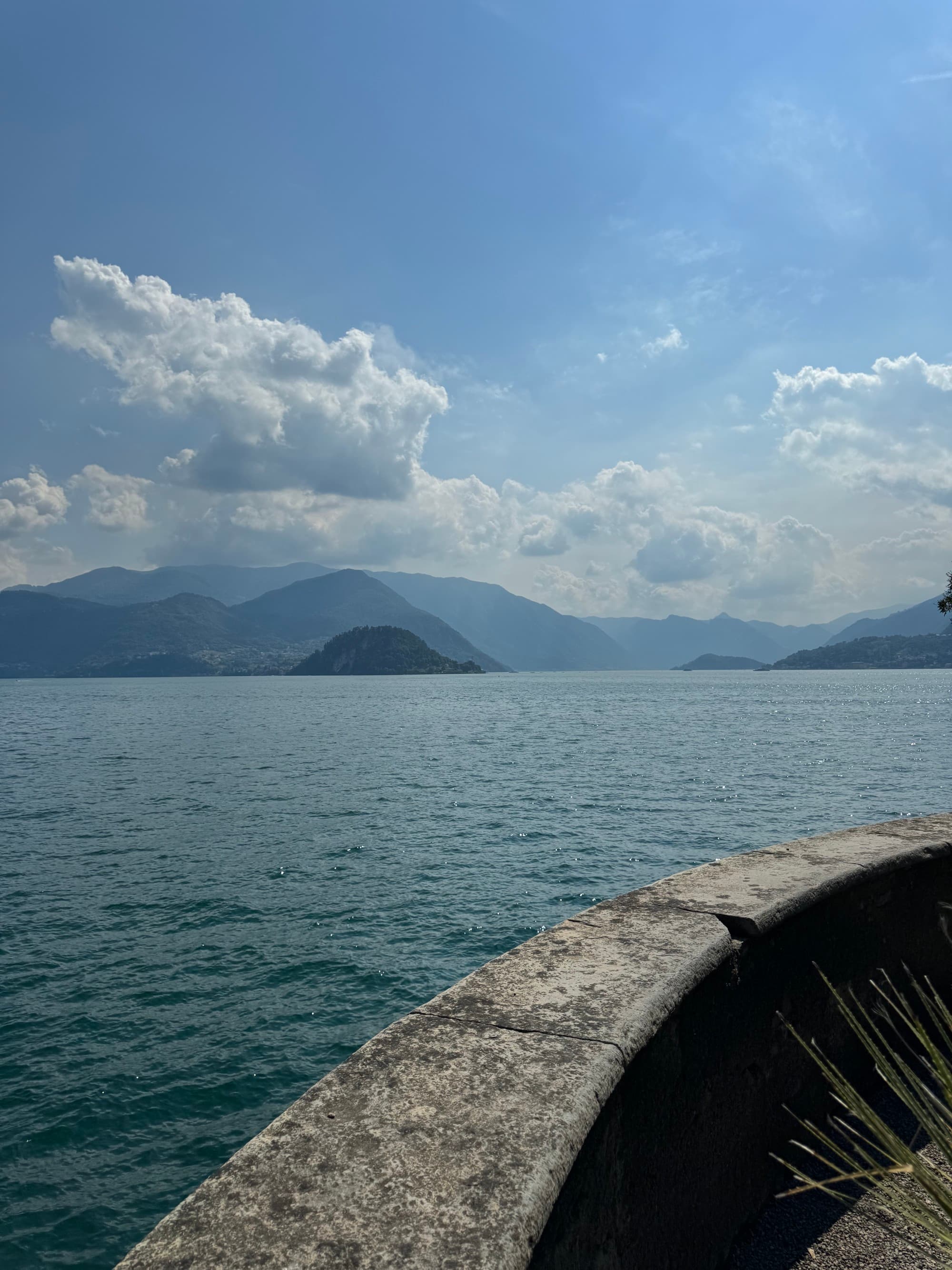 A lake in front of mountains during the daytime