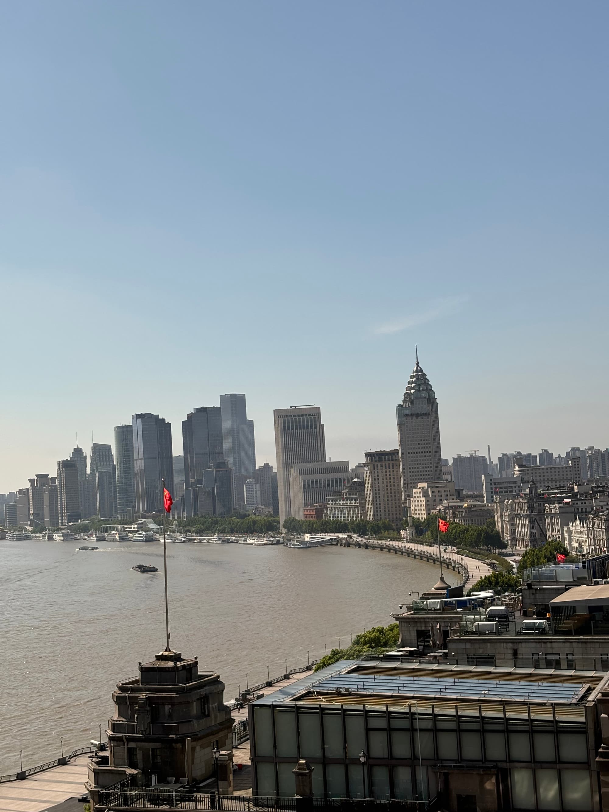 An aerial view of city buildings next to a body of water during the daytime