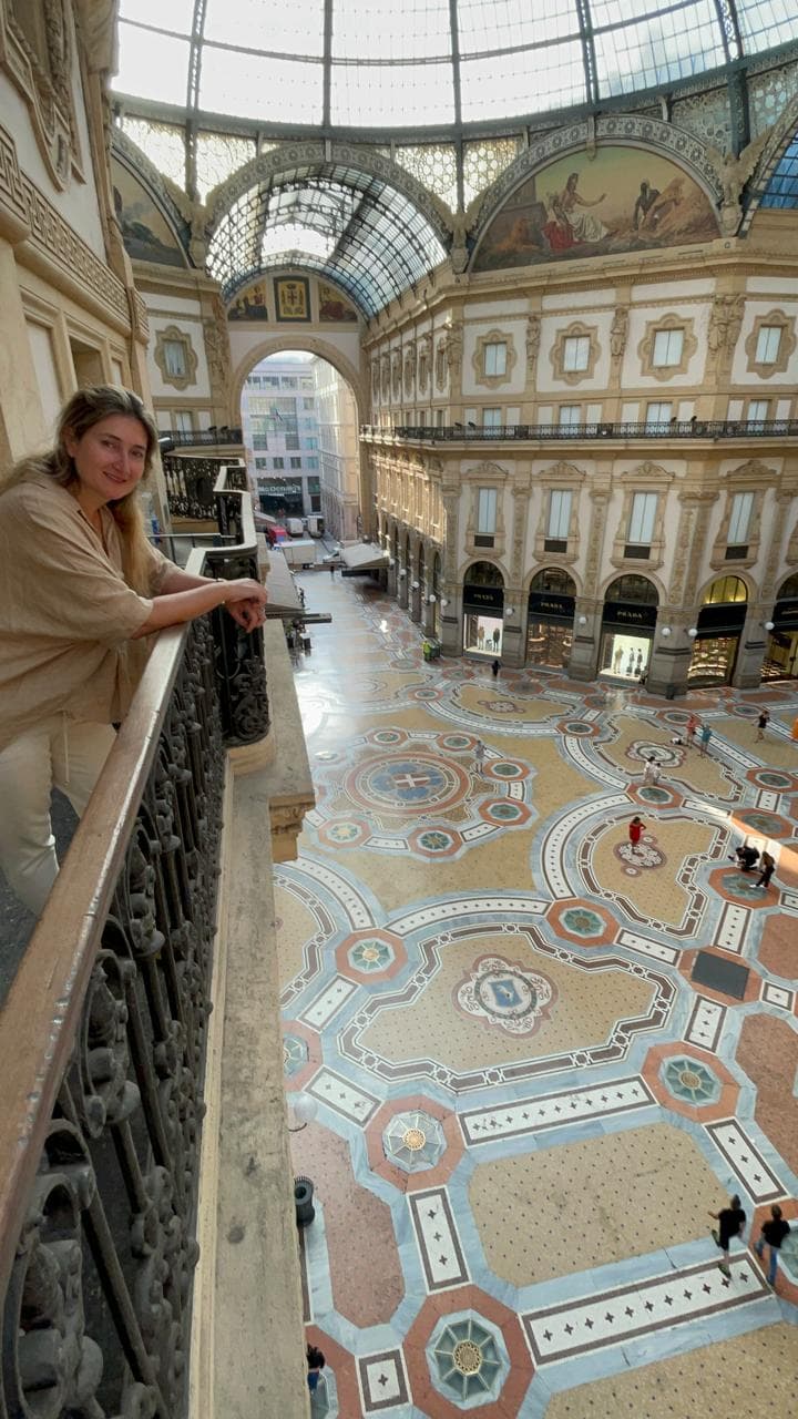 A balcony looking out onto the inside of a gallery building