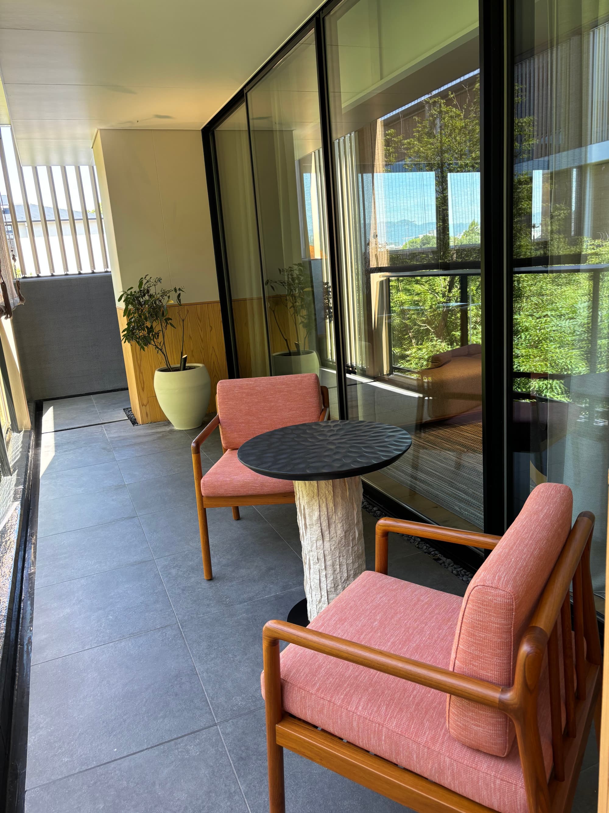 A seating area in an outdoor balcony