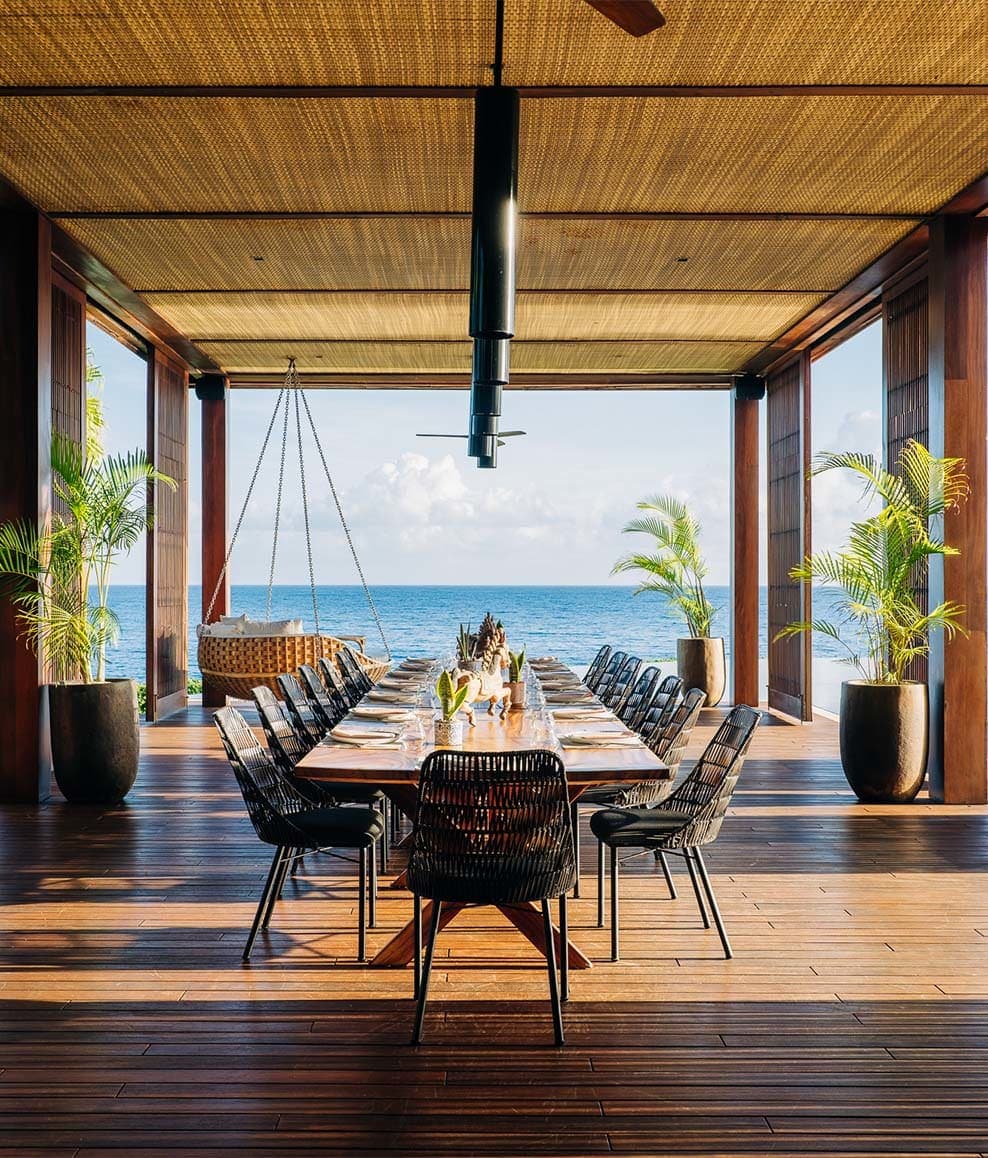 an open-air dining room overlooking the ocean