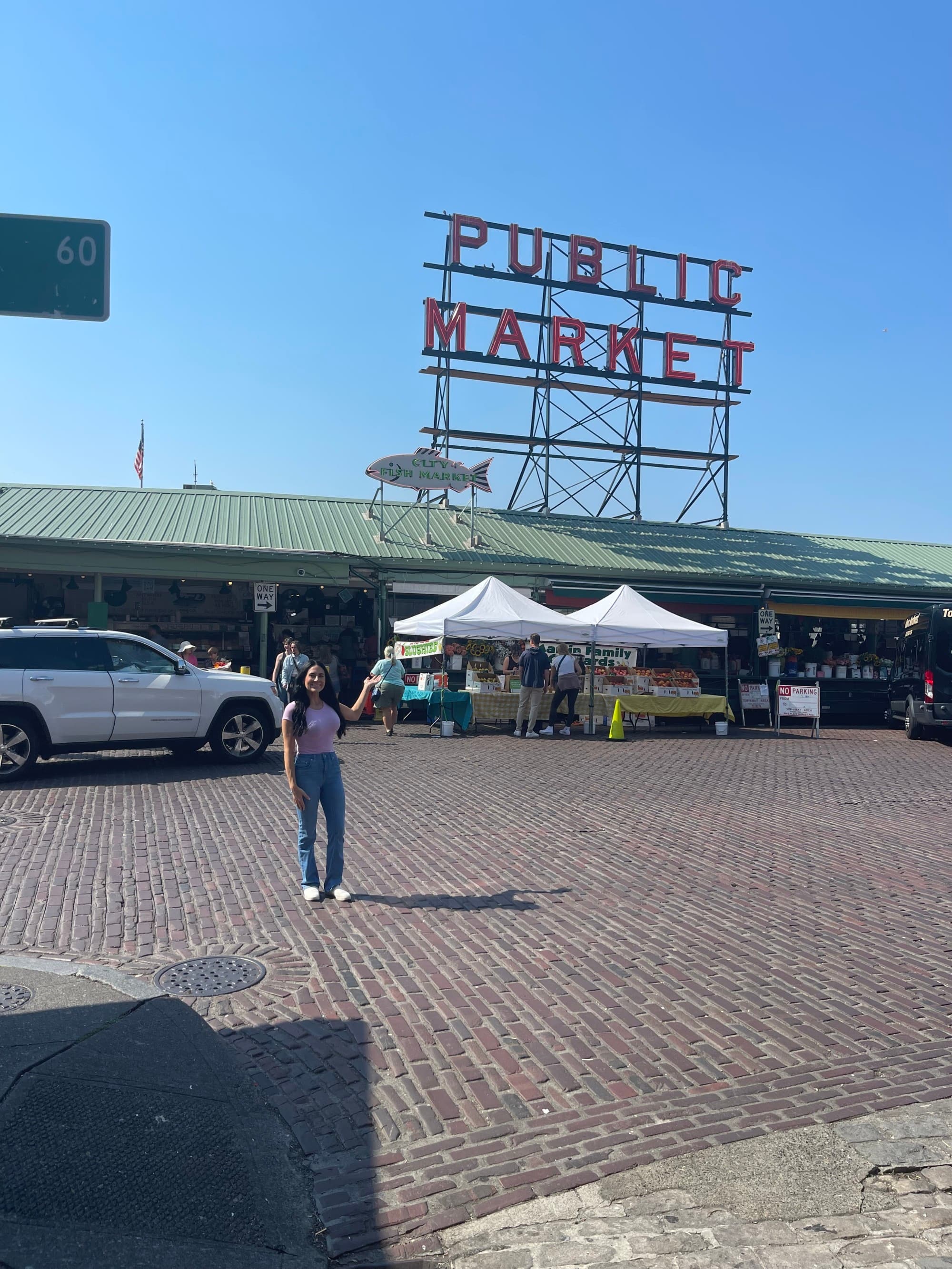 A sign reading "PUBLIC MARKET" above outside food stalls