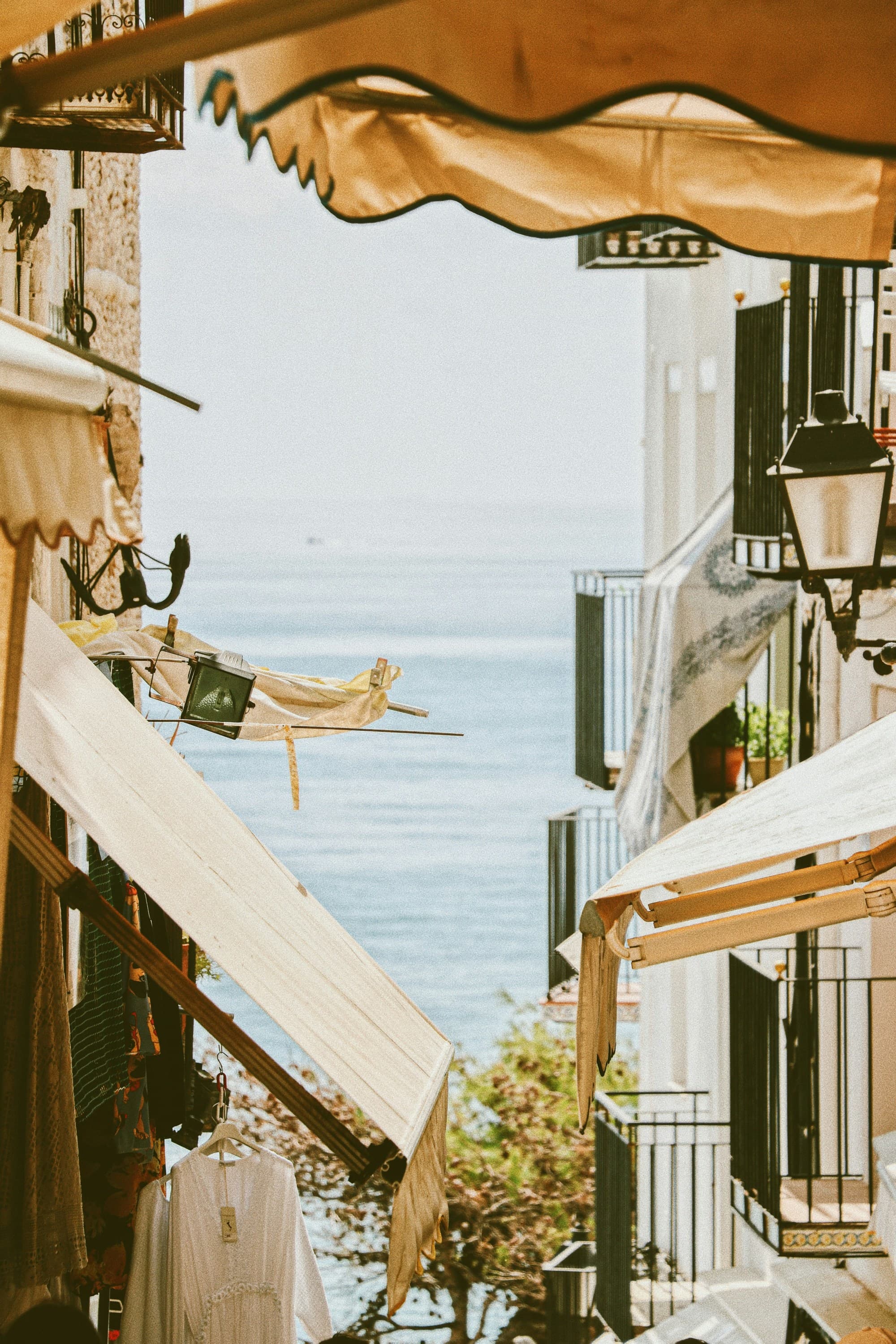 Buildings with ocean at back.