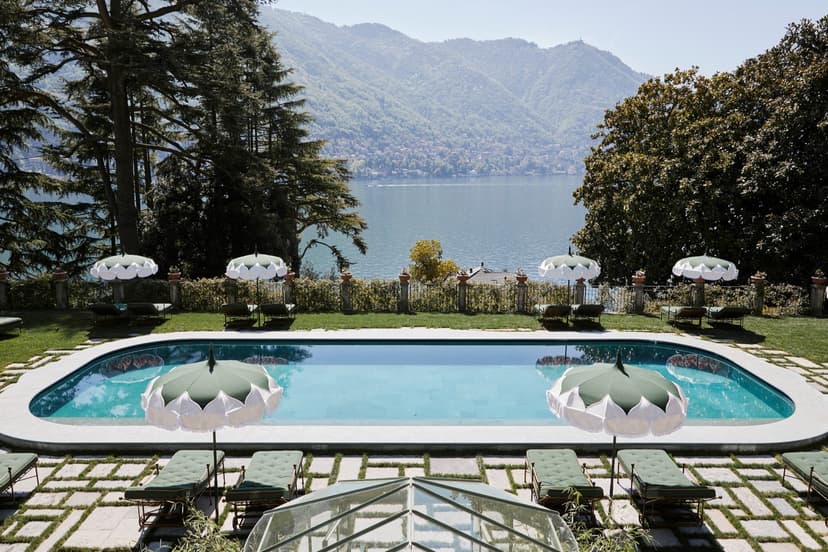 a swimming pool amidst a lakeside garden