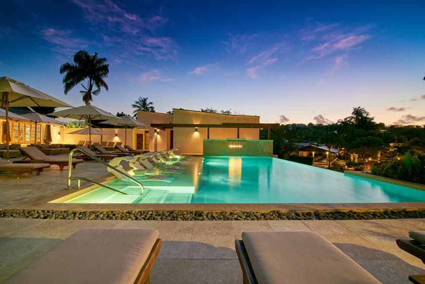 an illuminated infinity pool at night