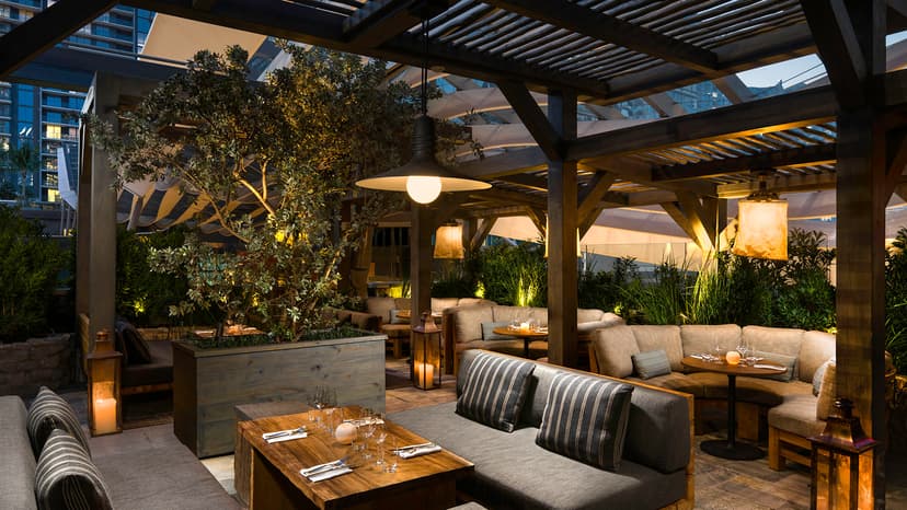 cozy dining area amid wooden beams and foliage