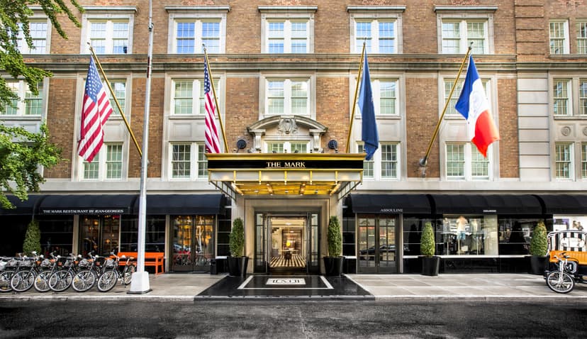 Hotel entrance flanked with bicycles and flags