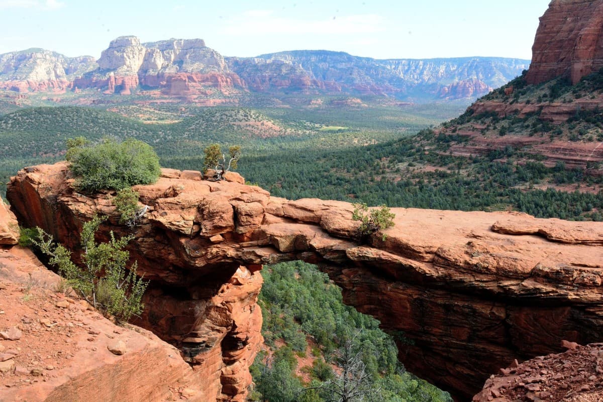 Beautiful view of a green valley amid red-rock mountains in Sedona, Arizona