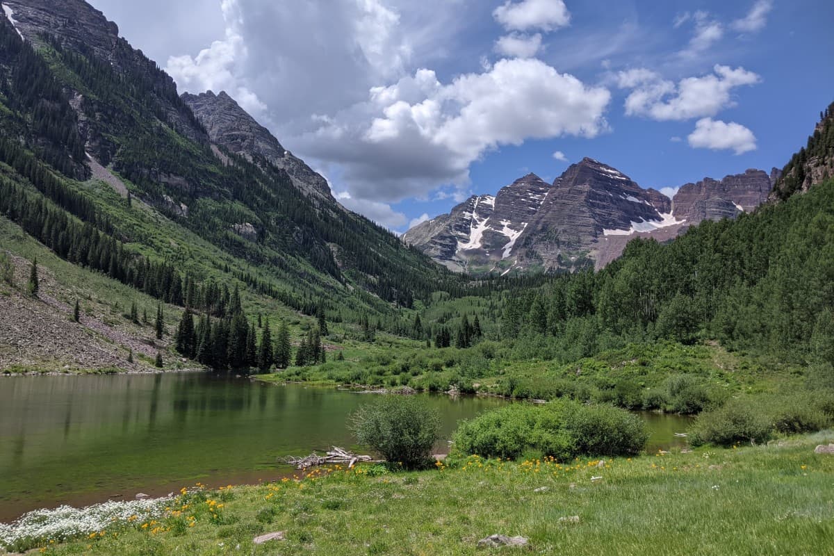 lake in an alpine valley amid a rocky peak