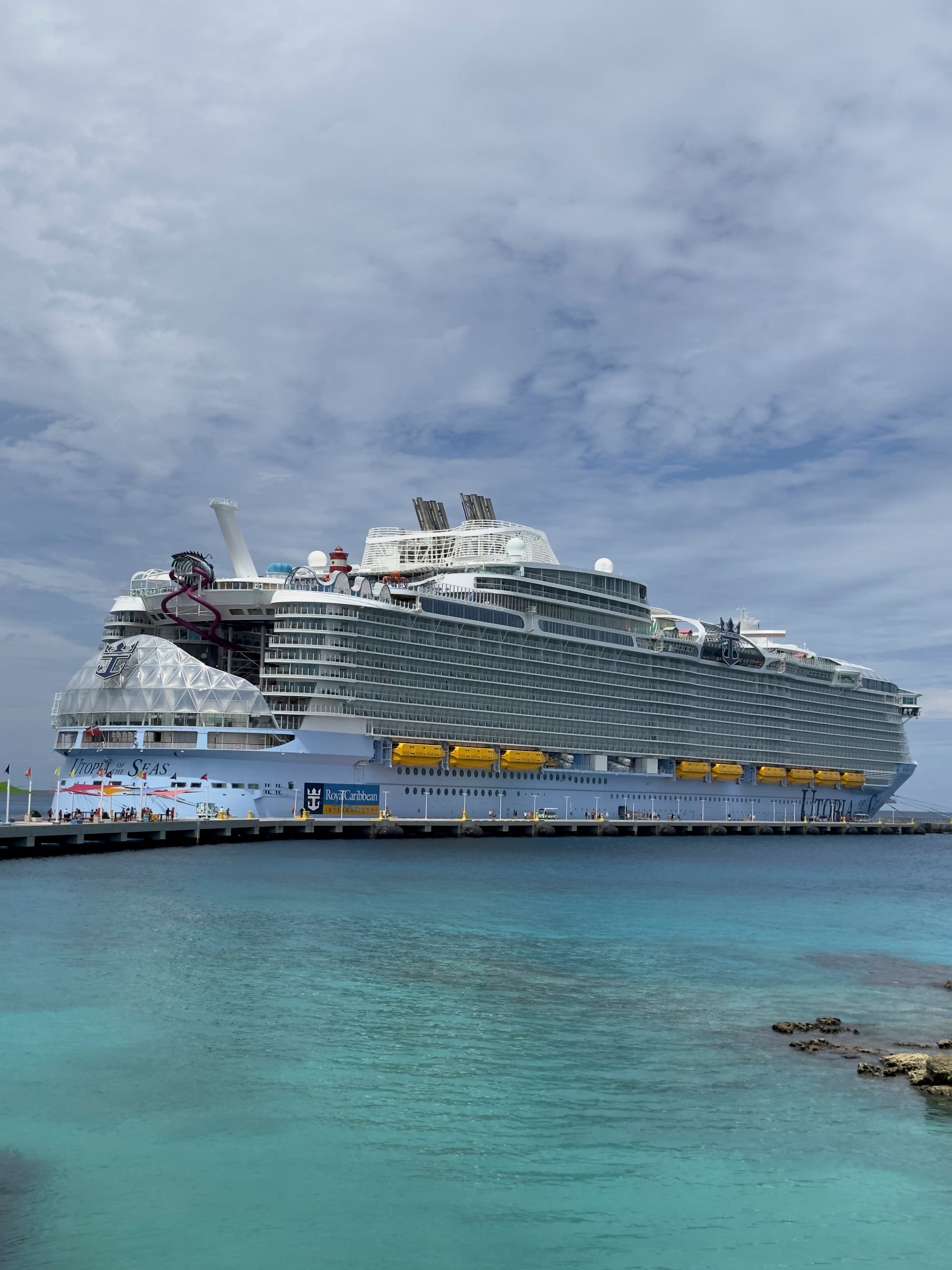 A view of a large cruise ship, Utopia of the Seas at Perfect Day at CocoCay