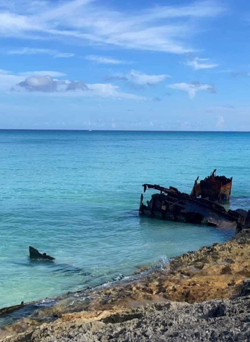 View of the ocean with scrap metal in the foreground.