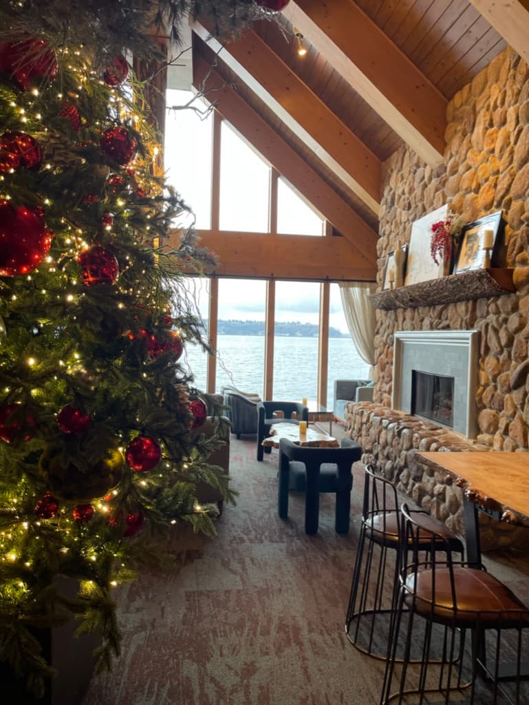 A hotel lobby with a festive tree in the middle