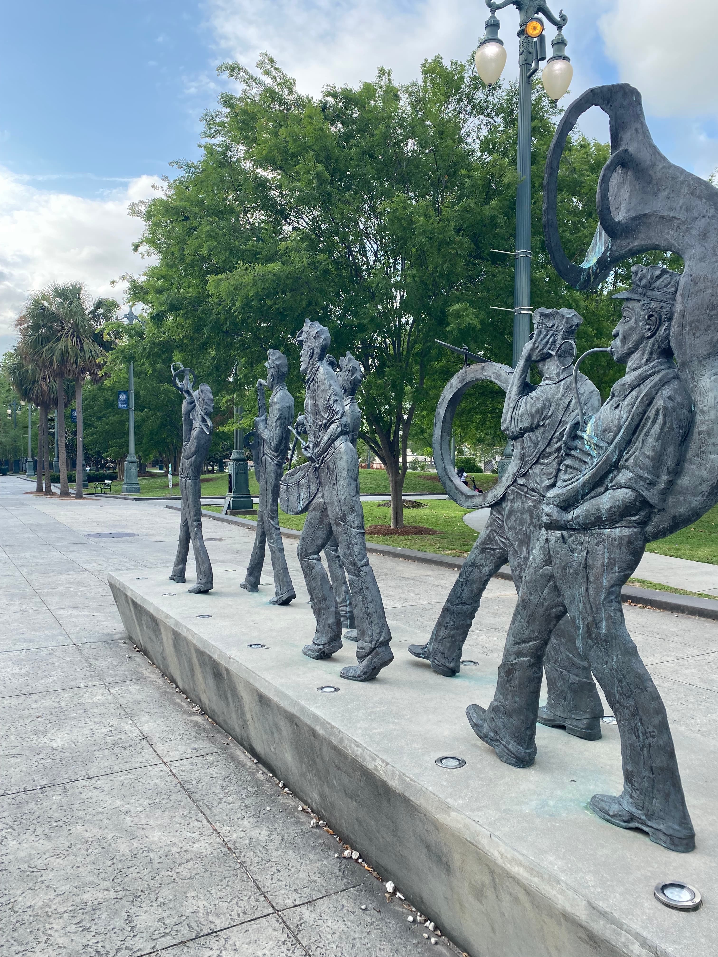 A line of sculptures playing musical instruments at Louis Armstrong Park near Hotel Mazarin New Orleans.