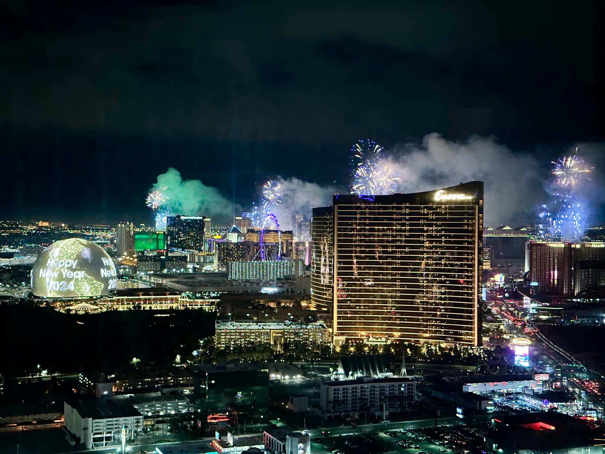 Aerial view of city buildings with a fireworks show