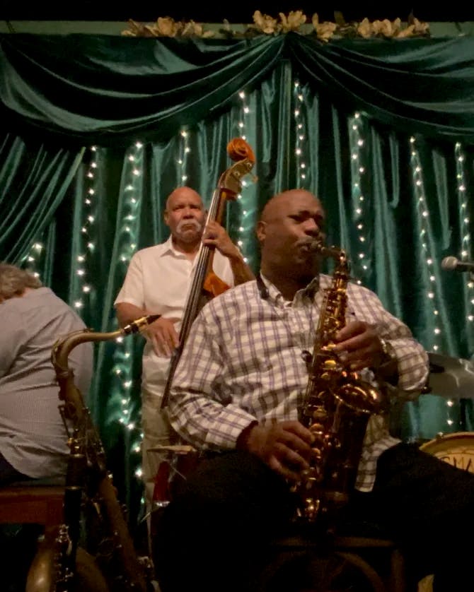 A jazz band playing at a nightclub 