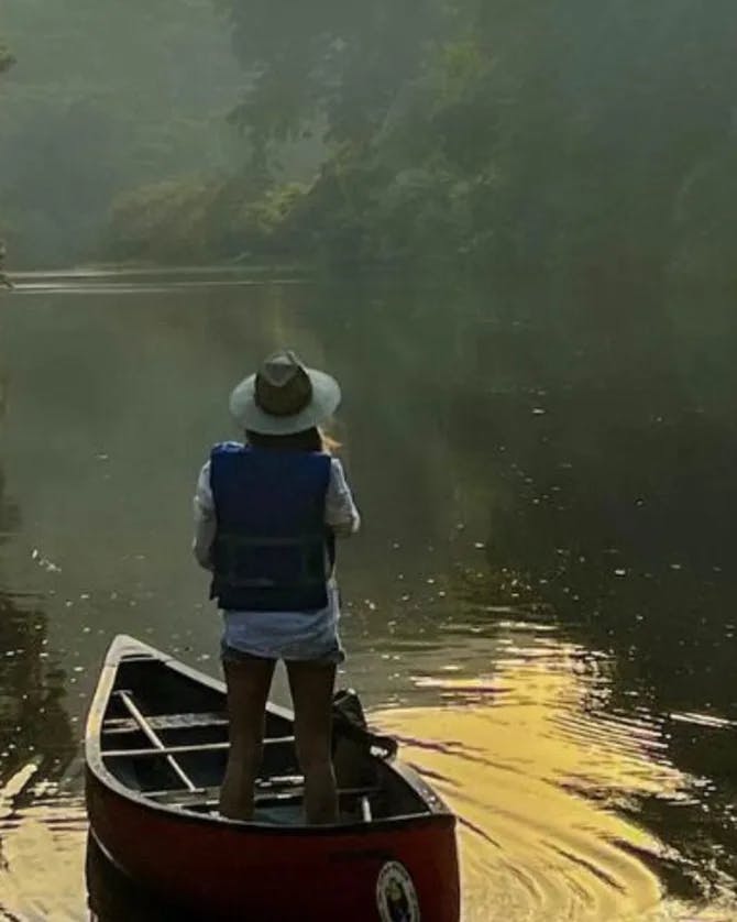 Picture of Loiuse standing in boat