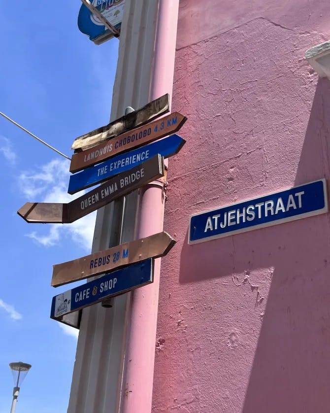 Picture of signs board on pink wall