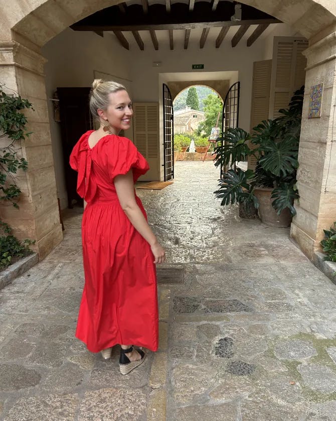 Posing for a photo in a red dress