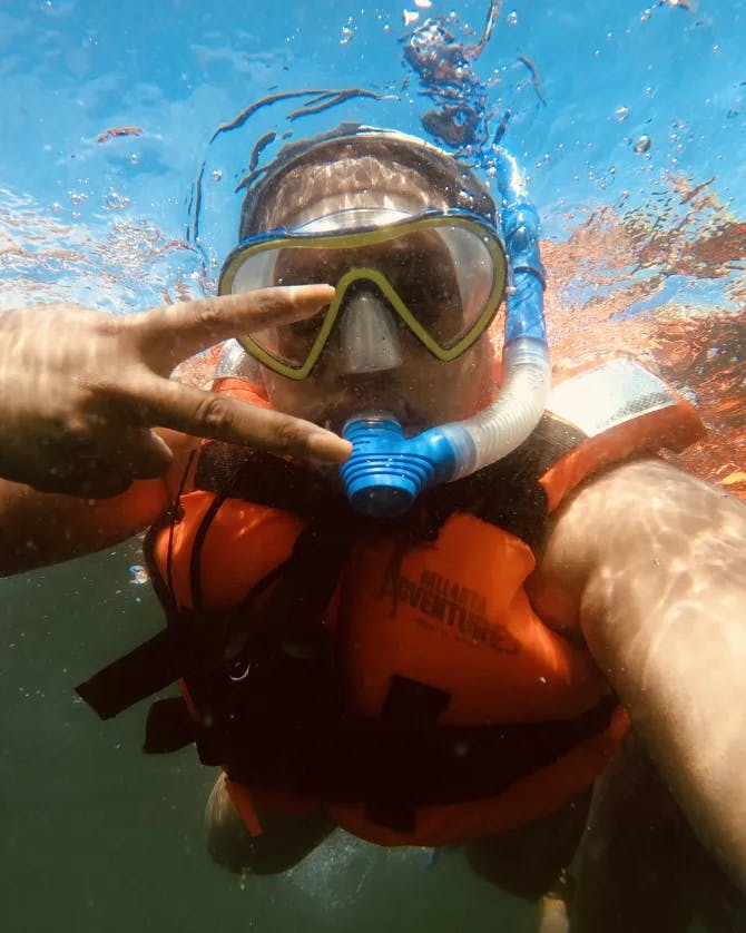 Travel advisor Antonisia taking an underwater selfie while snorkeling