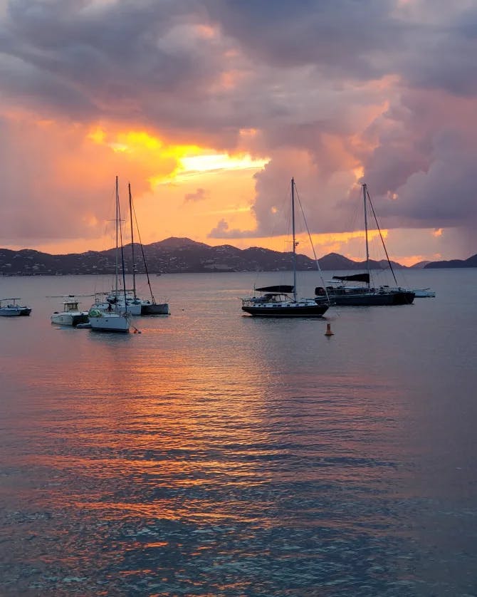 Beautiful view of boats in a the sea at sunset