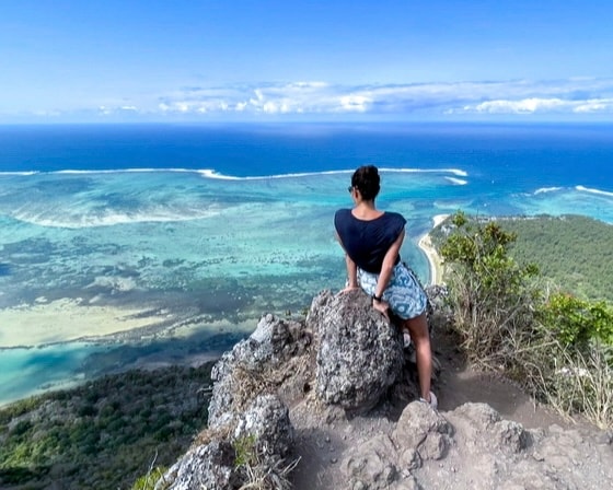 Travel Advisor Arlette Diederiks overlooking a bay.