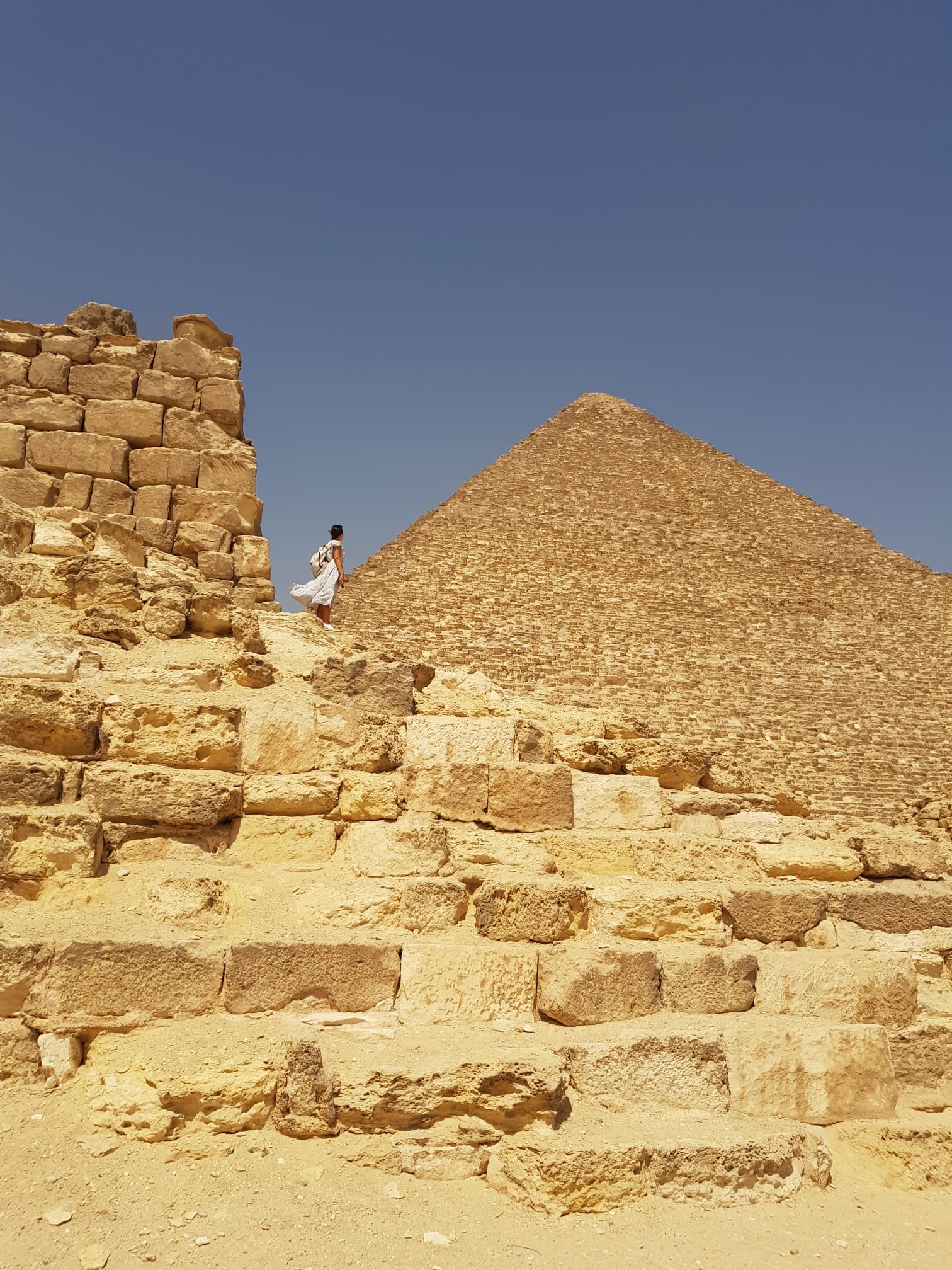 Travel advisor near a pyramid. 