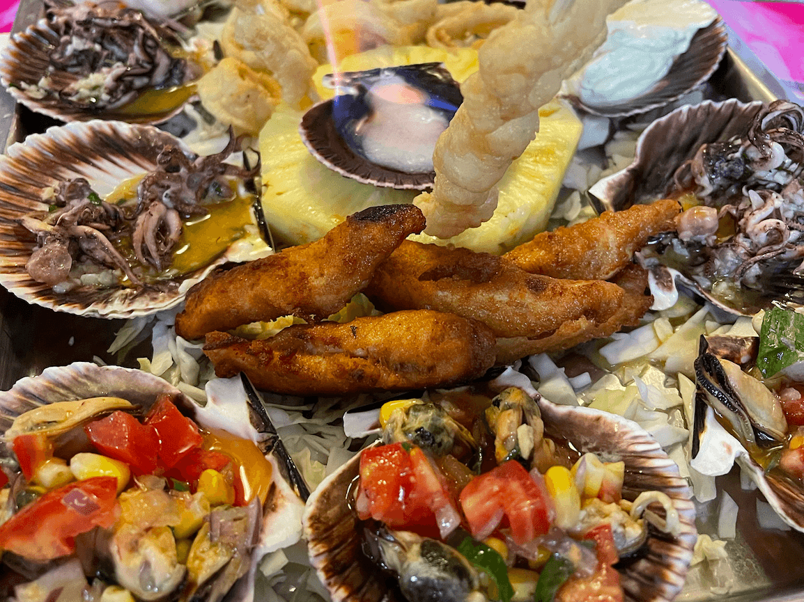 A tray filled with a variety of food items. 