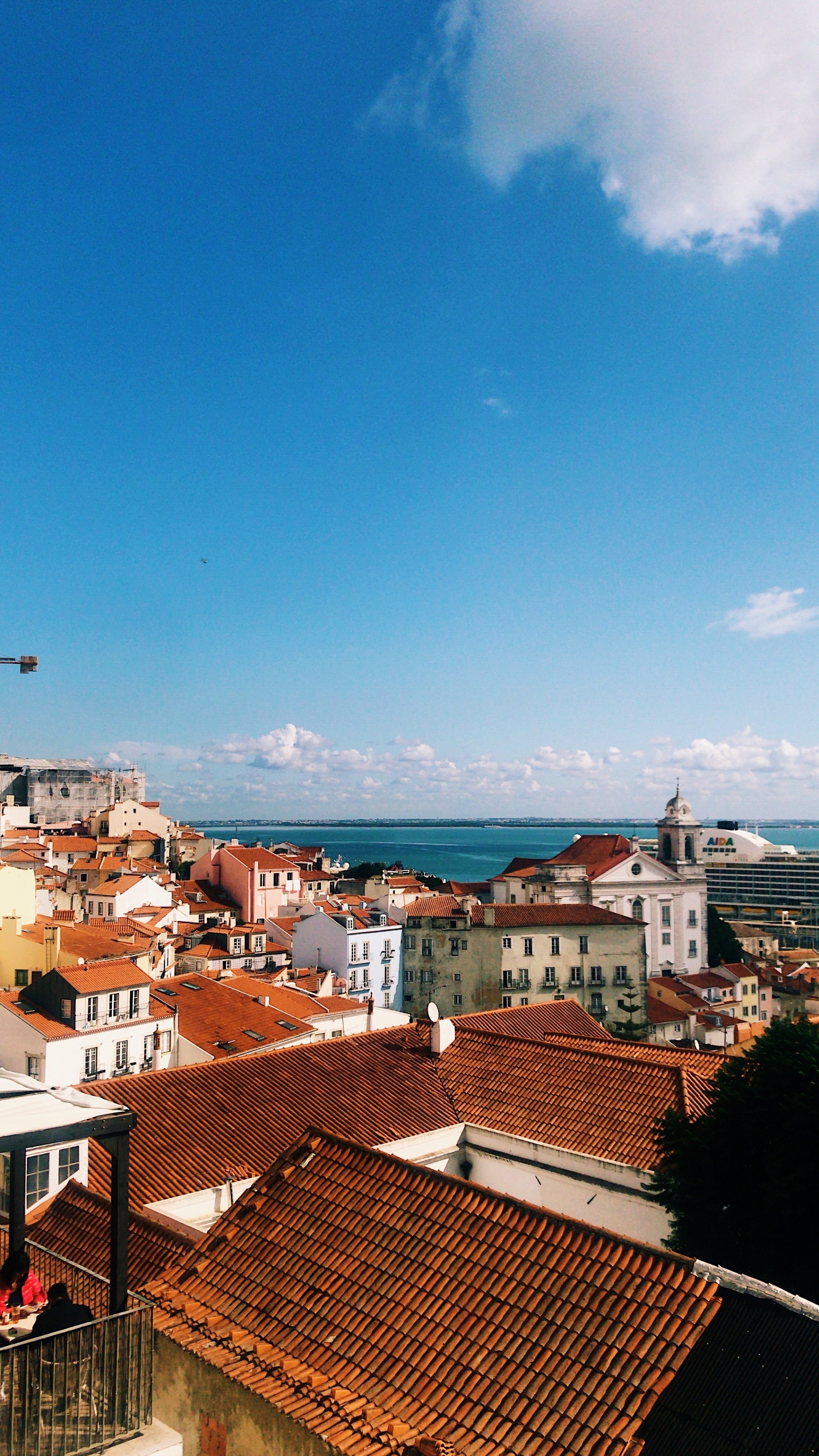 Tiled rooftops overlooking the sea.