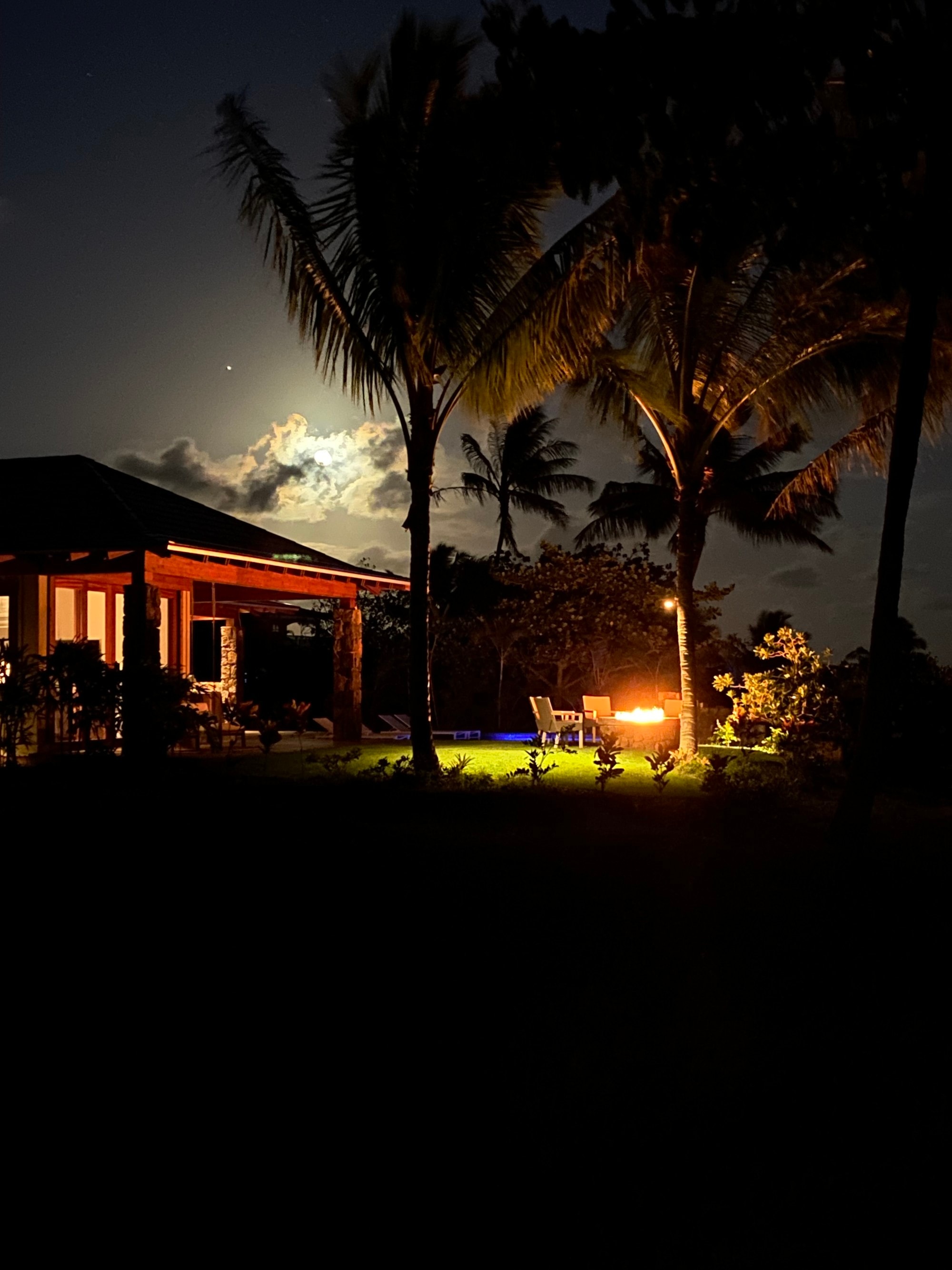 A resort with outdoor setting at night.