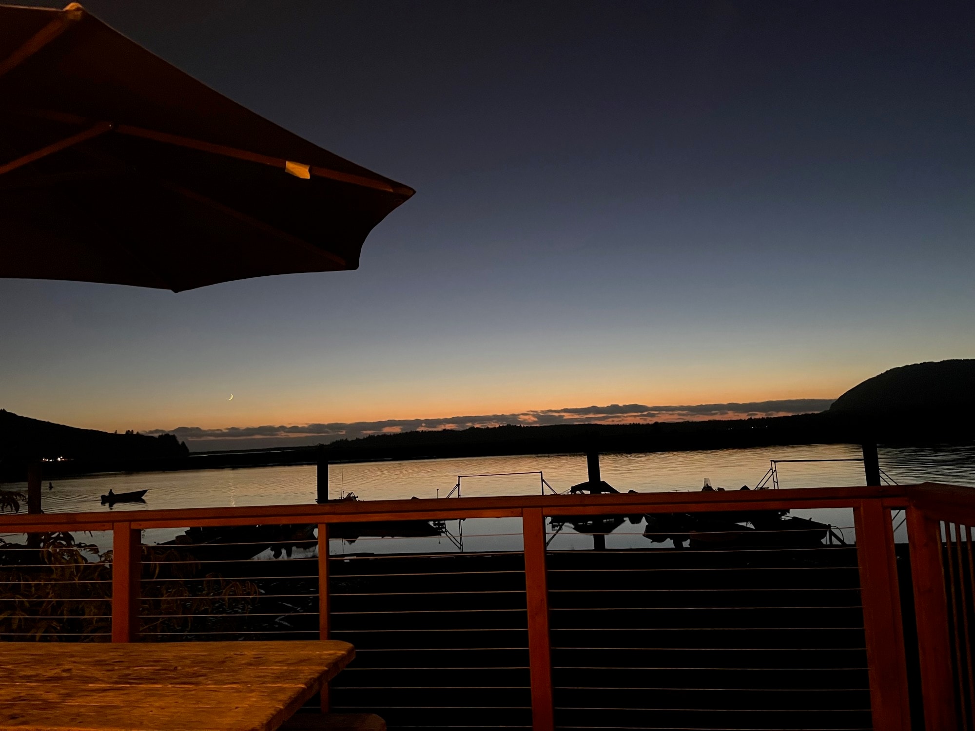 Outdoor restaurant sitting area by beach side.