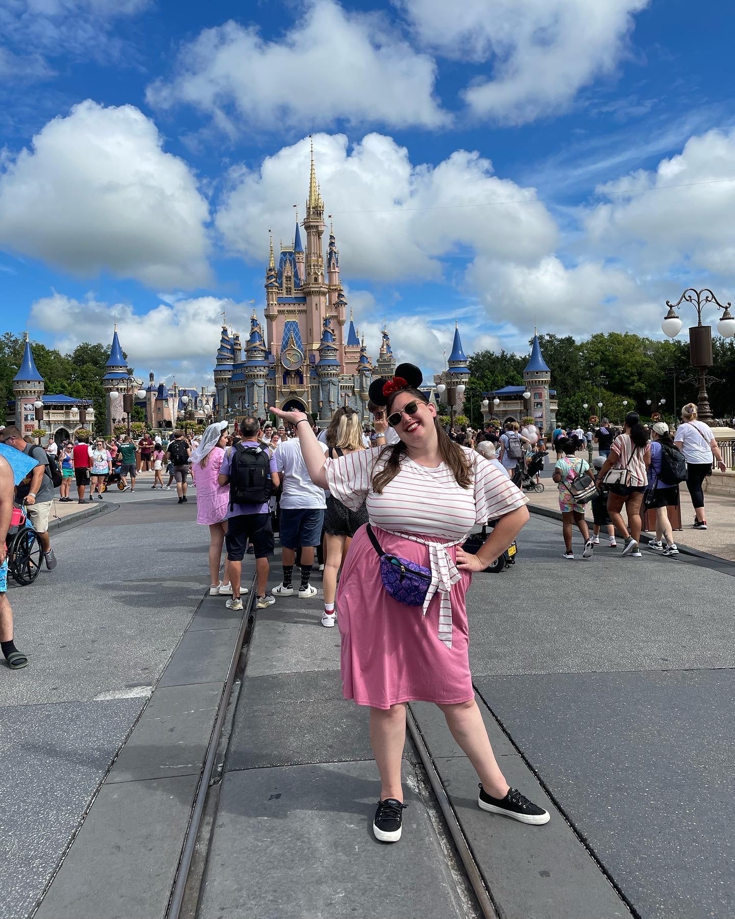 Travel advisor posing in front of Disney land