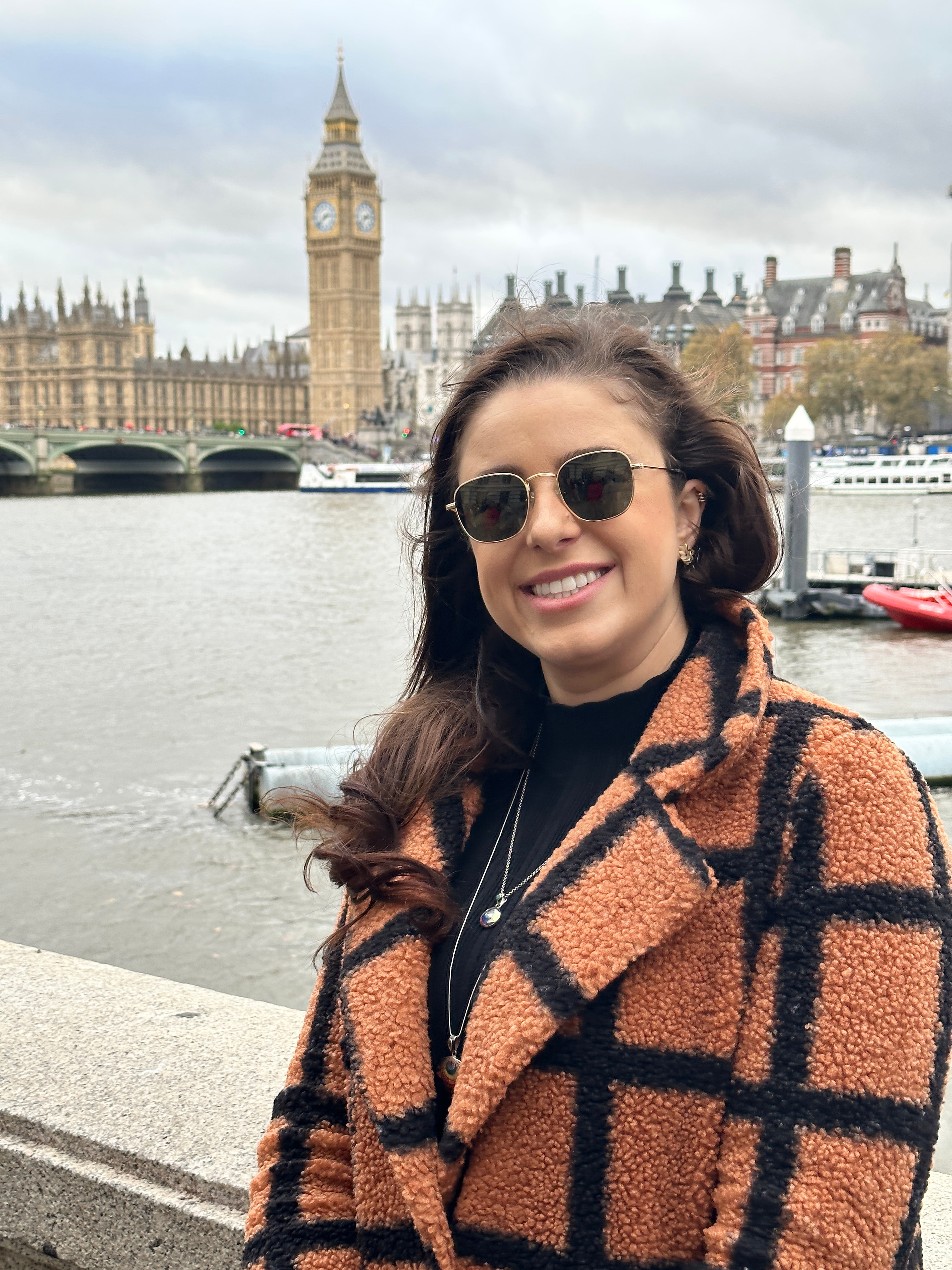 Sianne posing in brown and black coat