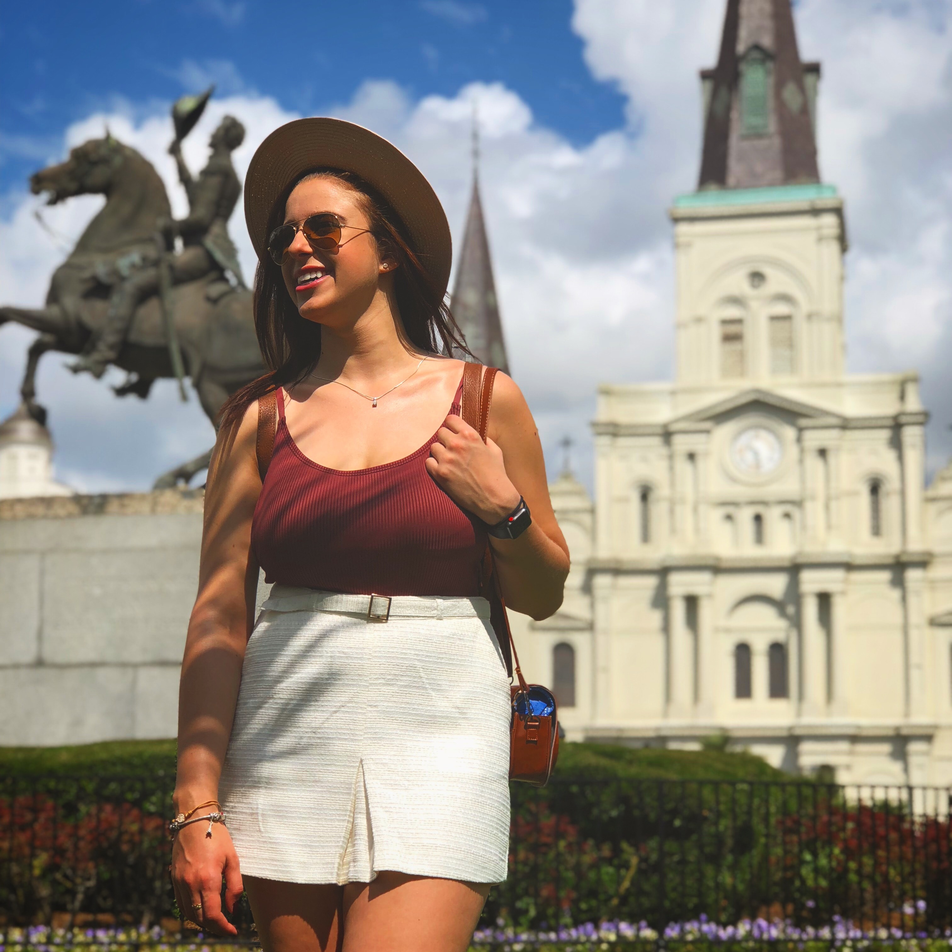 Sianne in brown top and white short skirt