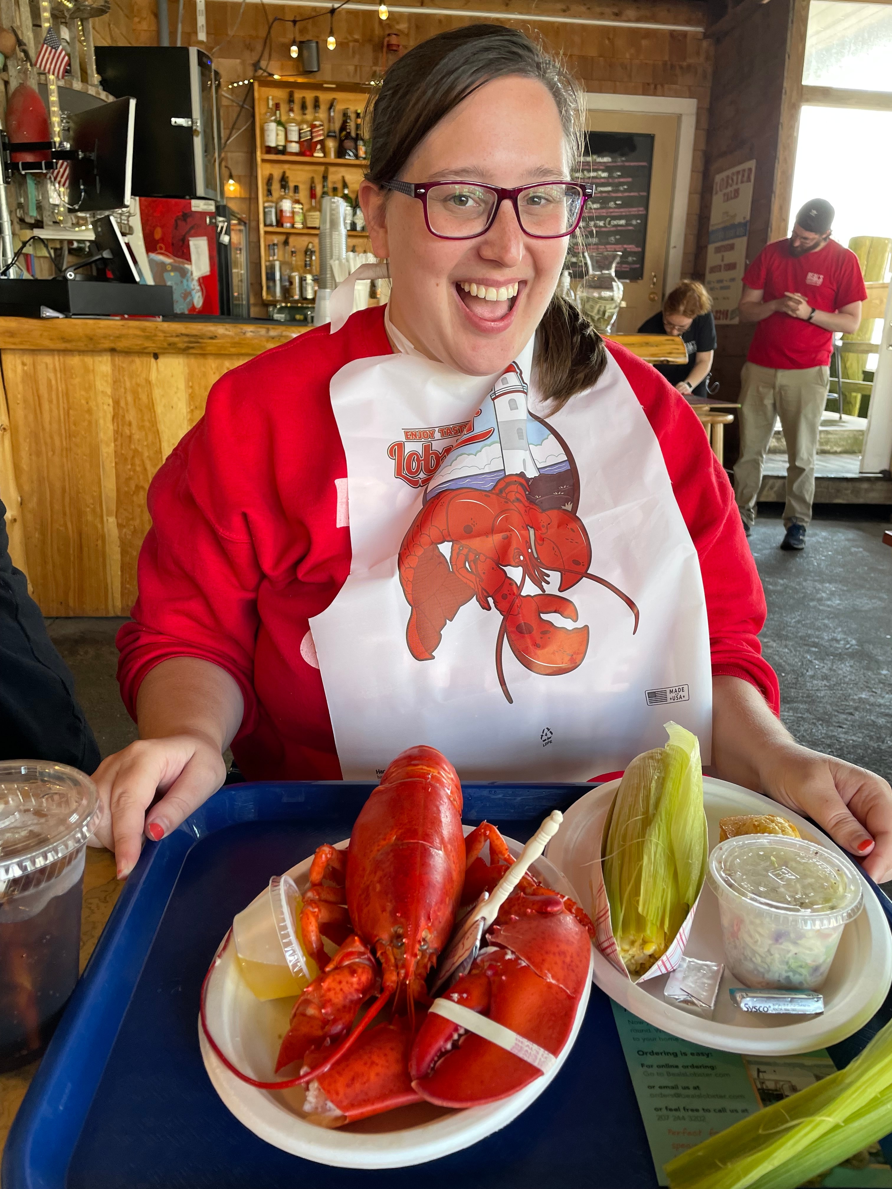 Travel advisor posing with food in front