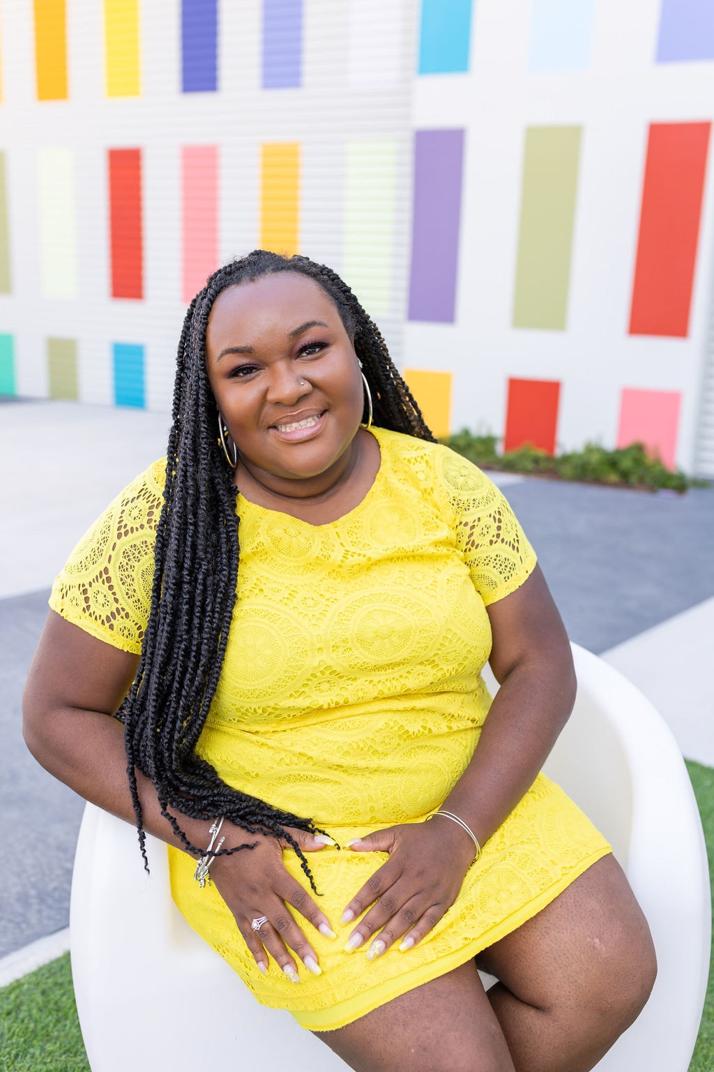 Travel advisor posing in yellow