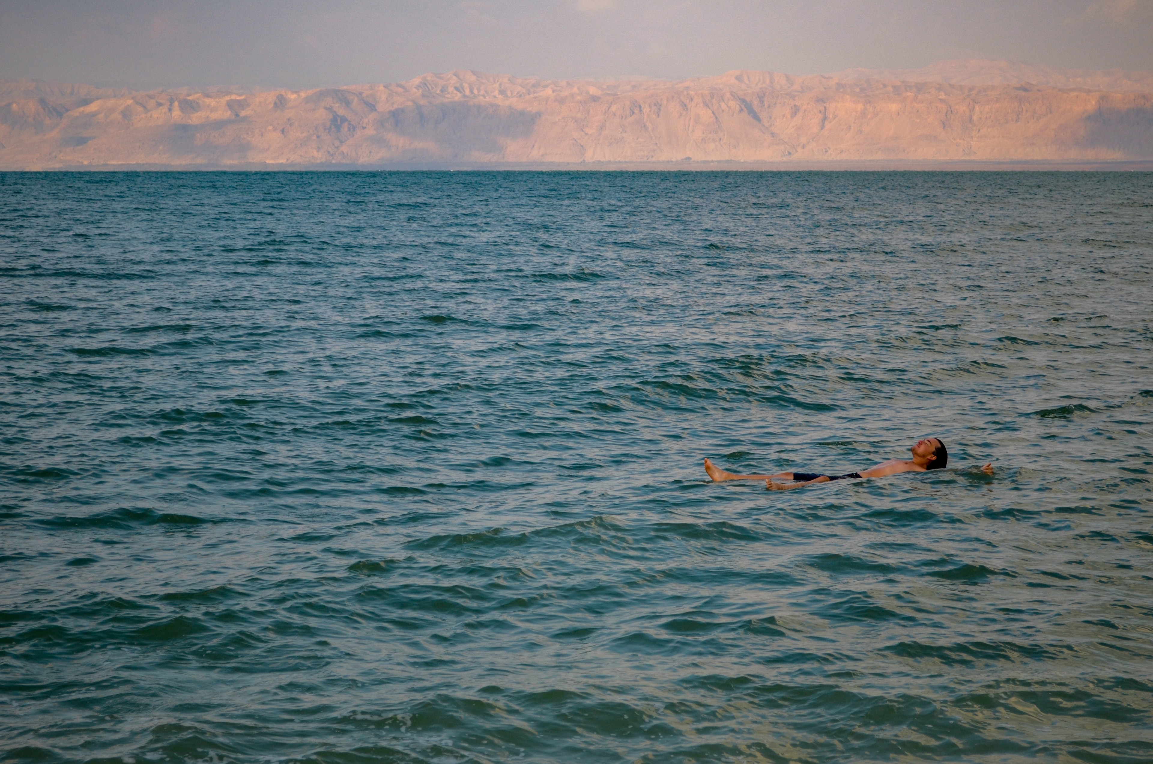 man-swimming-jordan-travel-guide