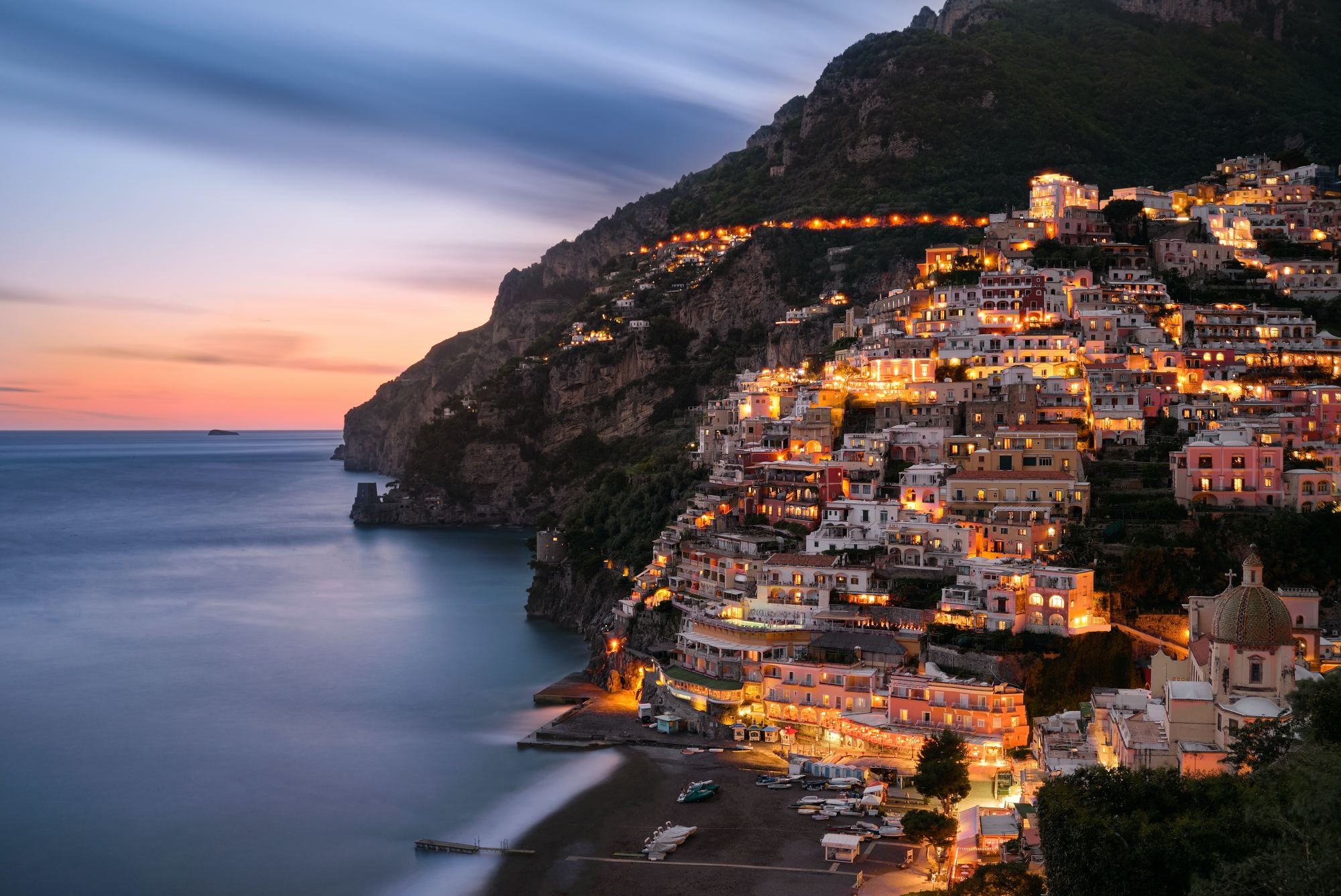 Buildings on hills at sea coast.