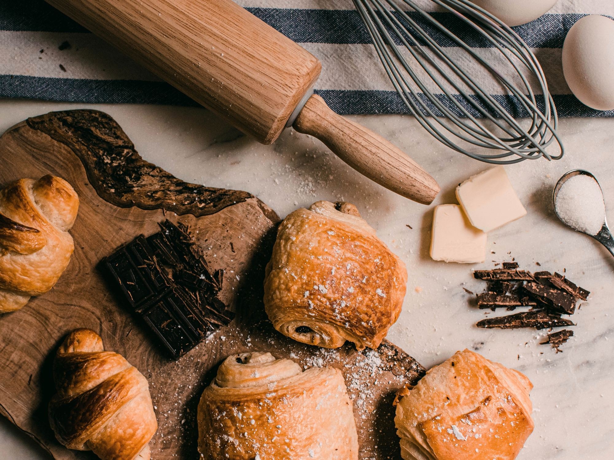 Pastries on a wooden tray.