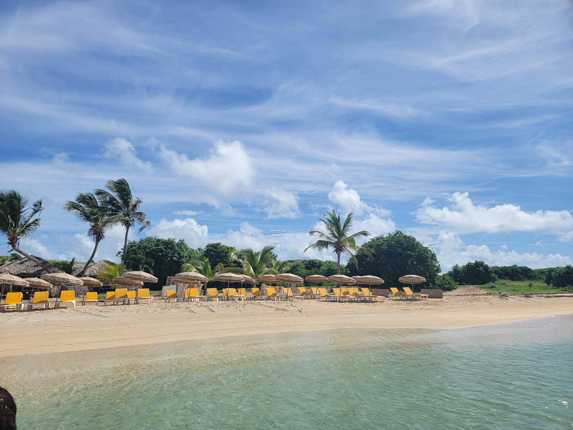 Picture of sunloungers and straw umbrella on a beach