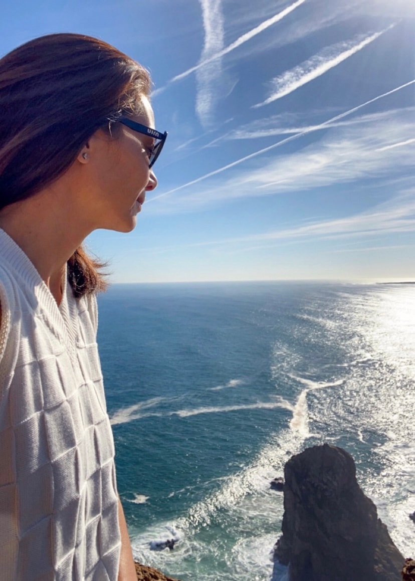 Travel Advisor Arlette Diederiks overlooking a bay.