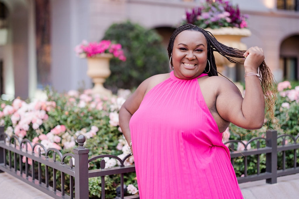 Travel advisor posing in shocking pink